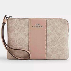 Coach corner zip wristlet in signature canvas with stripe